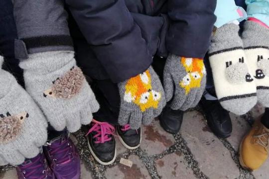 3 children wear the mittens